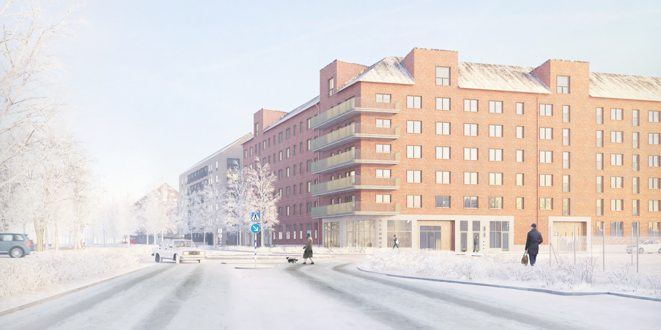 En väg med cirkulationsplats, bilar och människor samt ett stort flerbostadshus i vinkel bakom.
